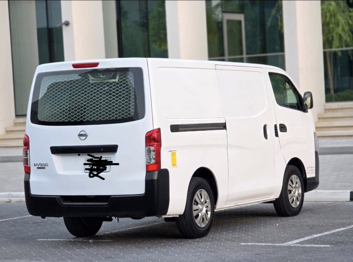 White Nissan NV350 van for moving and delivery in Fujairah